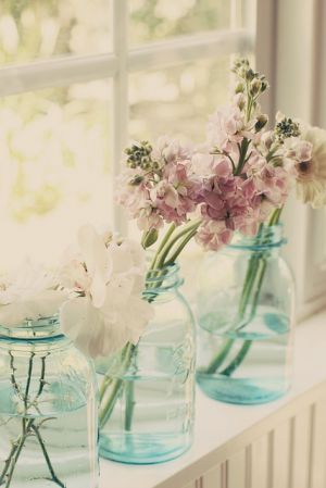 Flowers in vases - blue glass vases with flowers.jpg